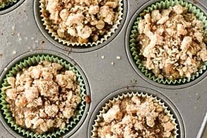 Pinterest graphic with muffins in the tray with the text overlay "apple oatmeal muffins."