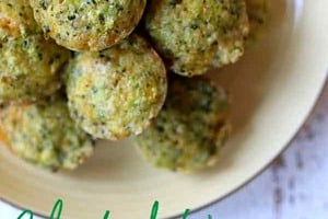 Pinterest graphic of a plate of mini broccoli and cheese egg muffins with the text overlay "Baby Lead Weaning Broccoli and Cheese Egg Muffins."