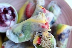 Pinterest graphic of a plate of rolls with the text overlay "vegan, gluten free fruit spring rolls."