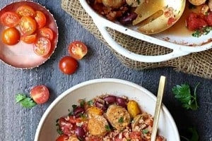 Pinterest graphic of a bowl of sausage casserole in front of a baking dish.