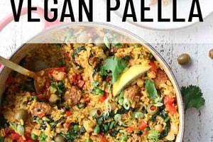 Pinterest graphic of the overhead view of a pot of paella beside a plate with the text overlay "vegan paella."