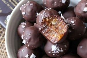 Pinterest graphic of the overhead view with text overlay "tahini and dates caramel truffles."