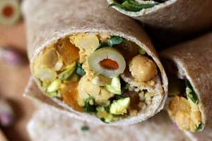 Pinterest graphic of vegan chickpea salad wraps cut in half.