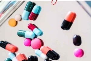 Pinterest graphic of an assortment of pills with the text overlay "taking drugs for anxiety while pregnant."