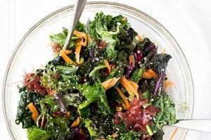 Pinterest graphic of a bowl of salad with the text overlay "vegan pregnancy diet essential nutrients."
