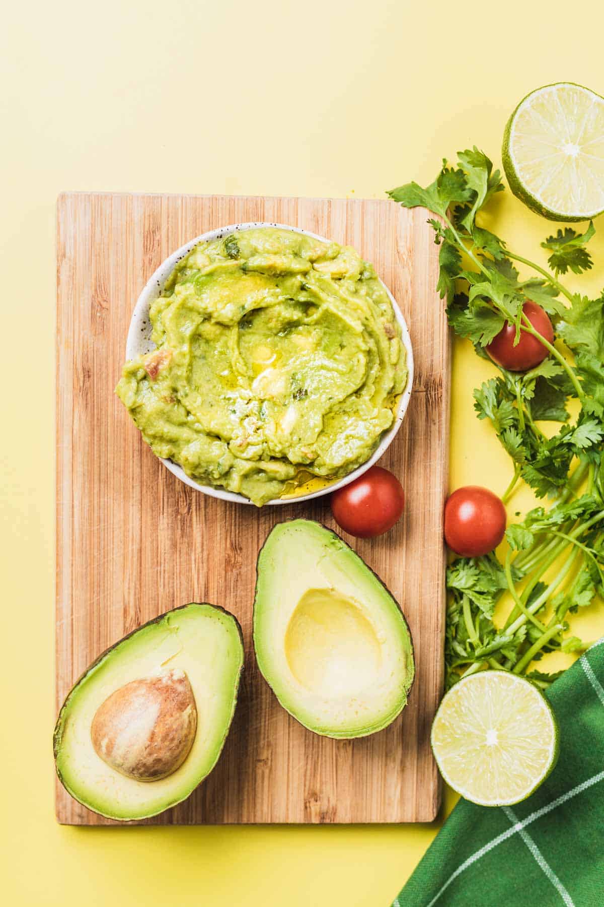 Birds eye view of guacamole in a white bowl.