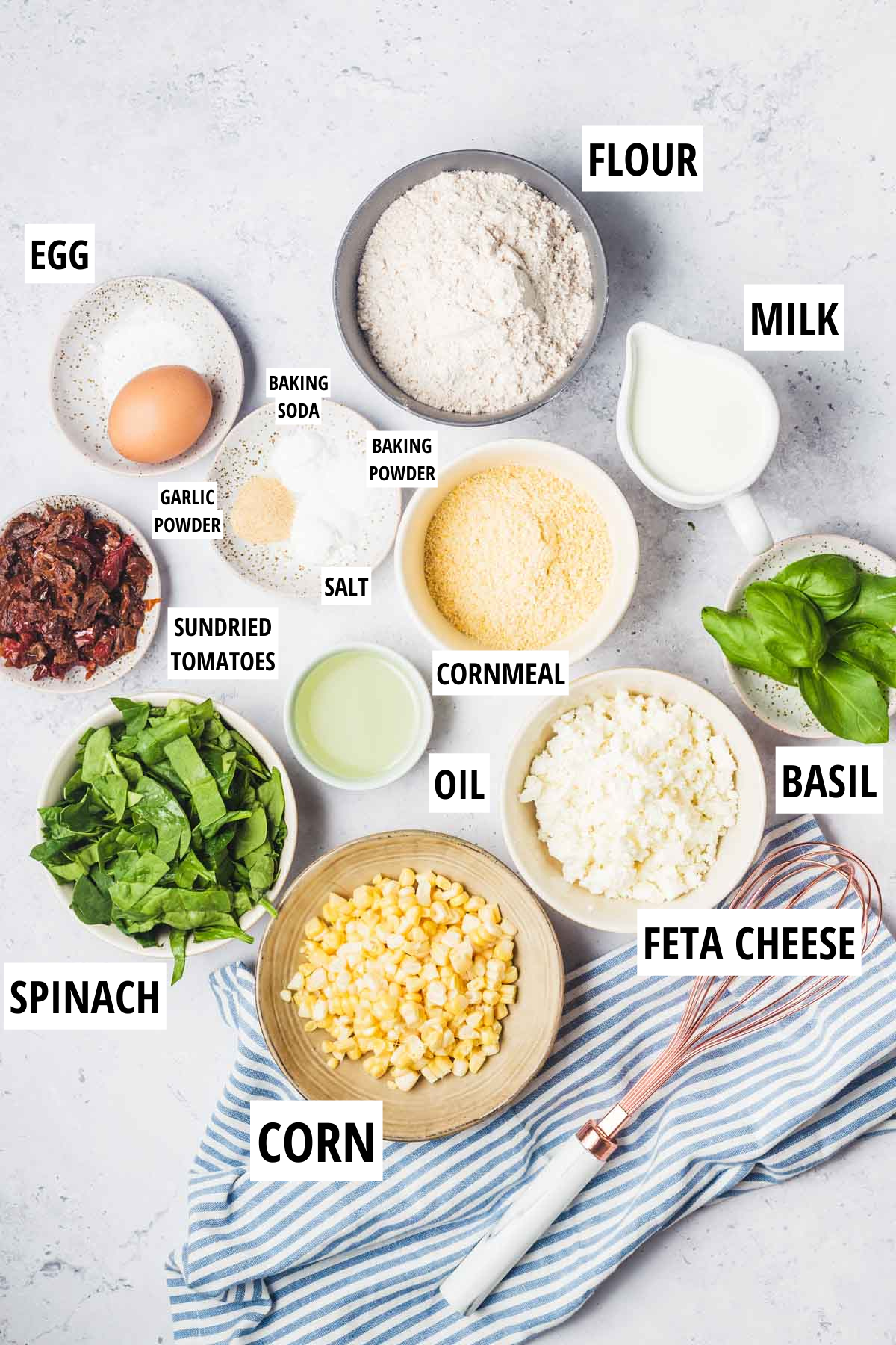 Labelled ingredients for savoury muffins with feta and vegetables.