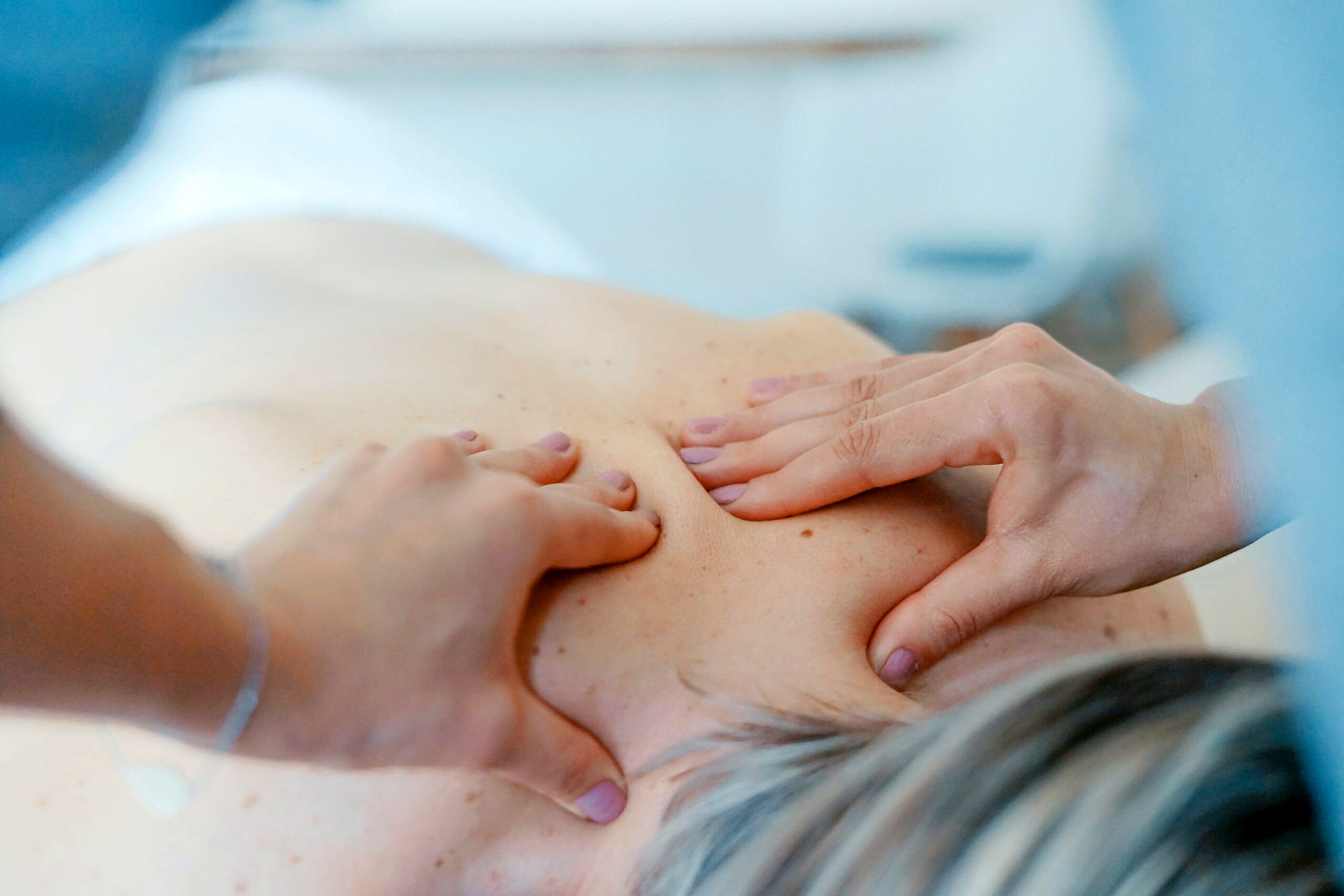 Close up image of a person being massaged.