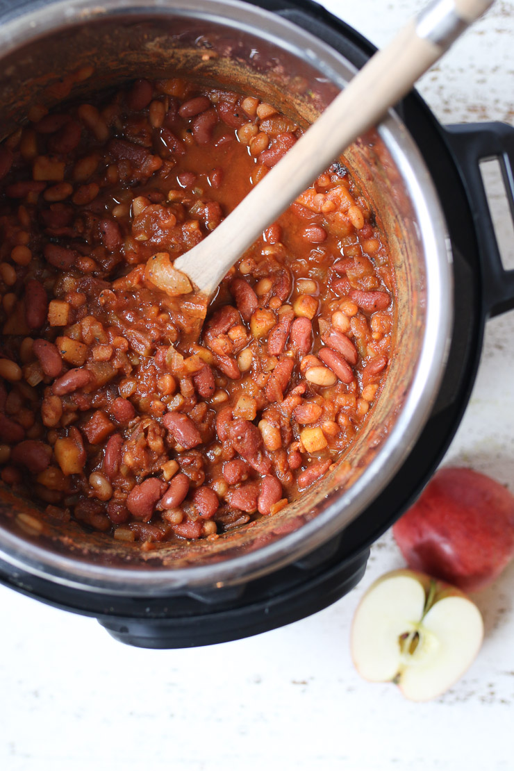 Birds eye view of an instant pot full of vegan baked beans. 