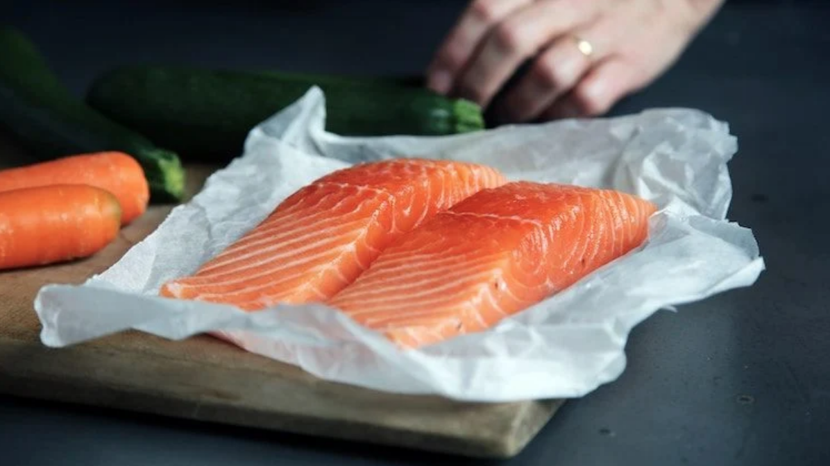 Salmon filets on a tray.