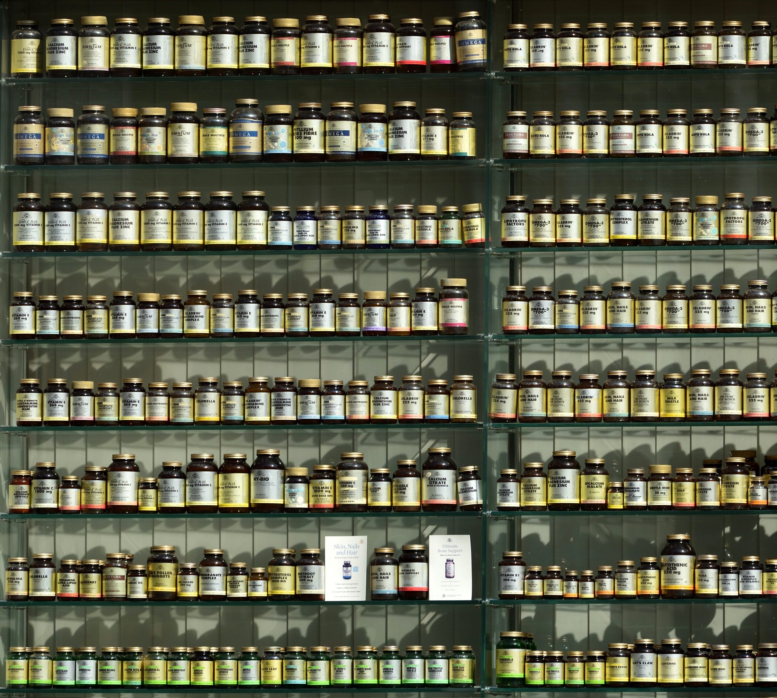 Wall with bottles of supplements.