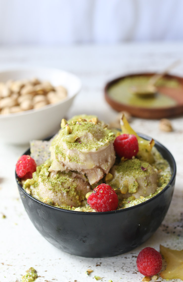 A bowl of banana nice cream topped with fruit. 