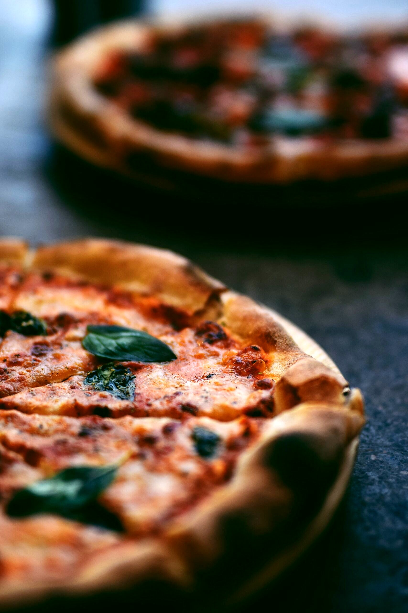 Close up of a pizza slice from a pizza pie.