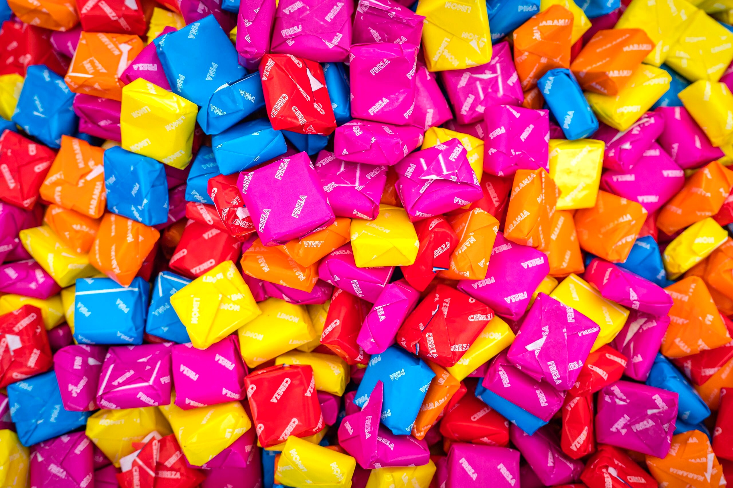 Close up image of colourful packed candy.