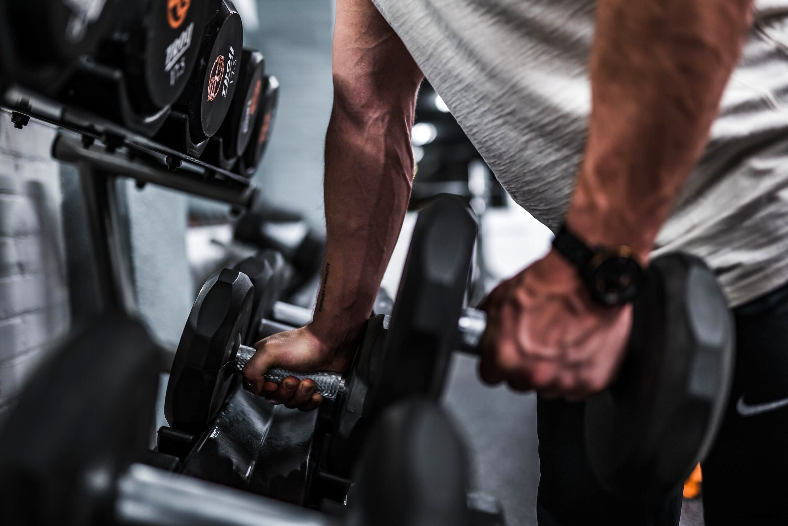 Hand holding a dumbbell.