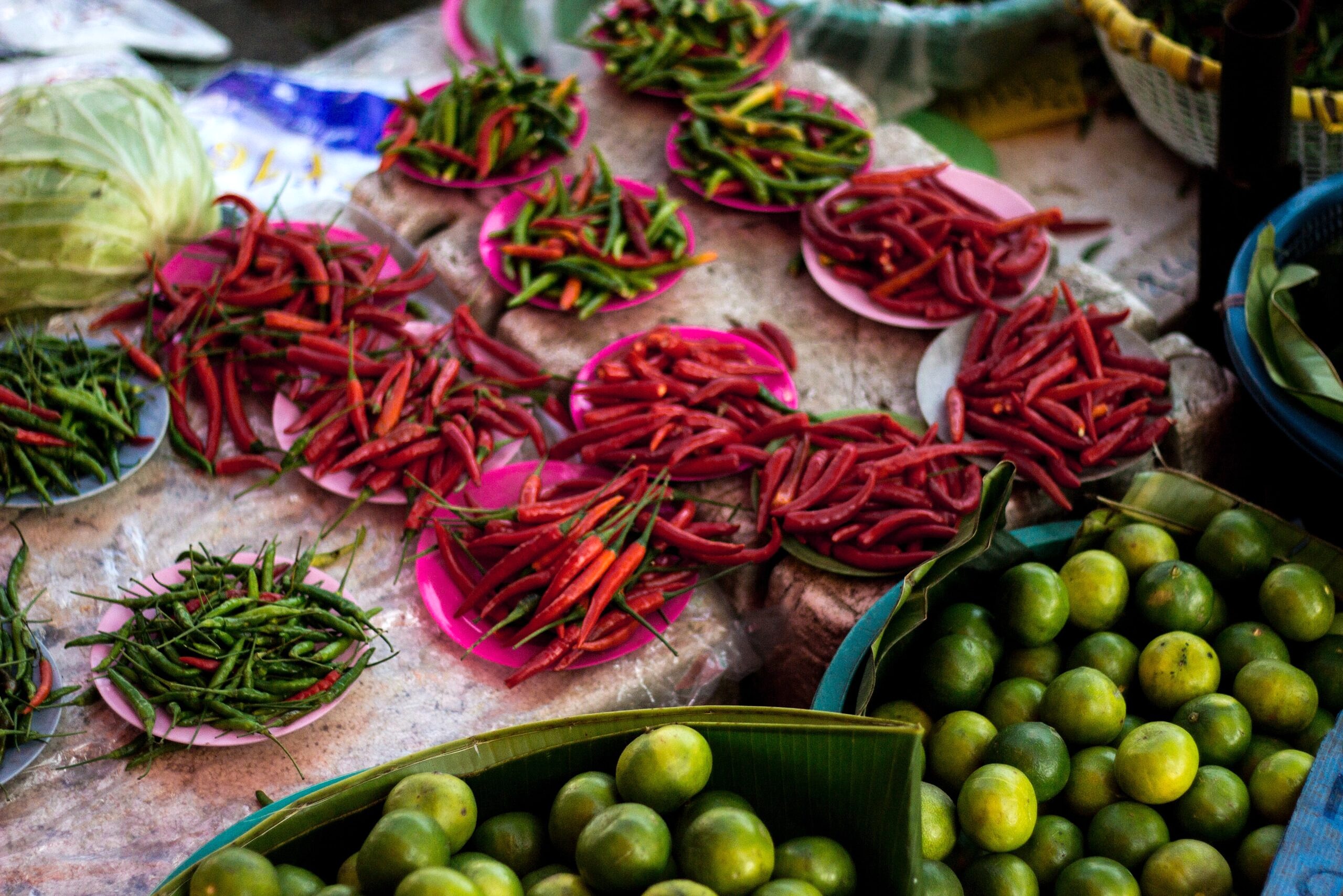 Image of chilis and limes on a table.