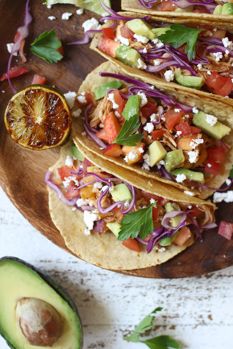 Close up of pulled chicken tacos with peaches.