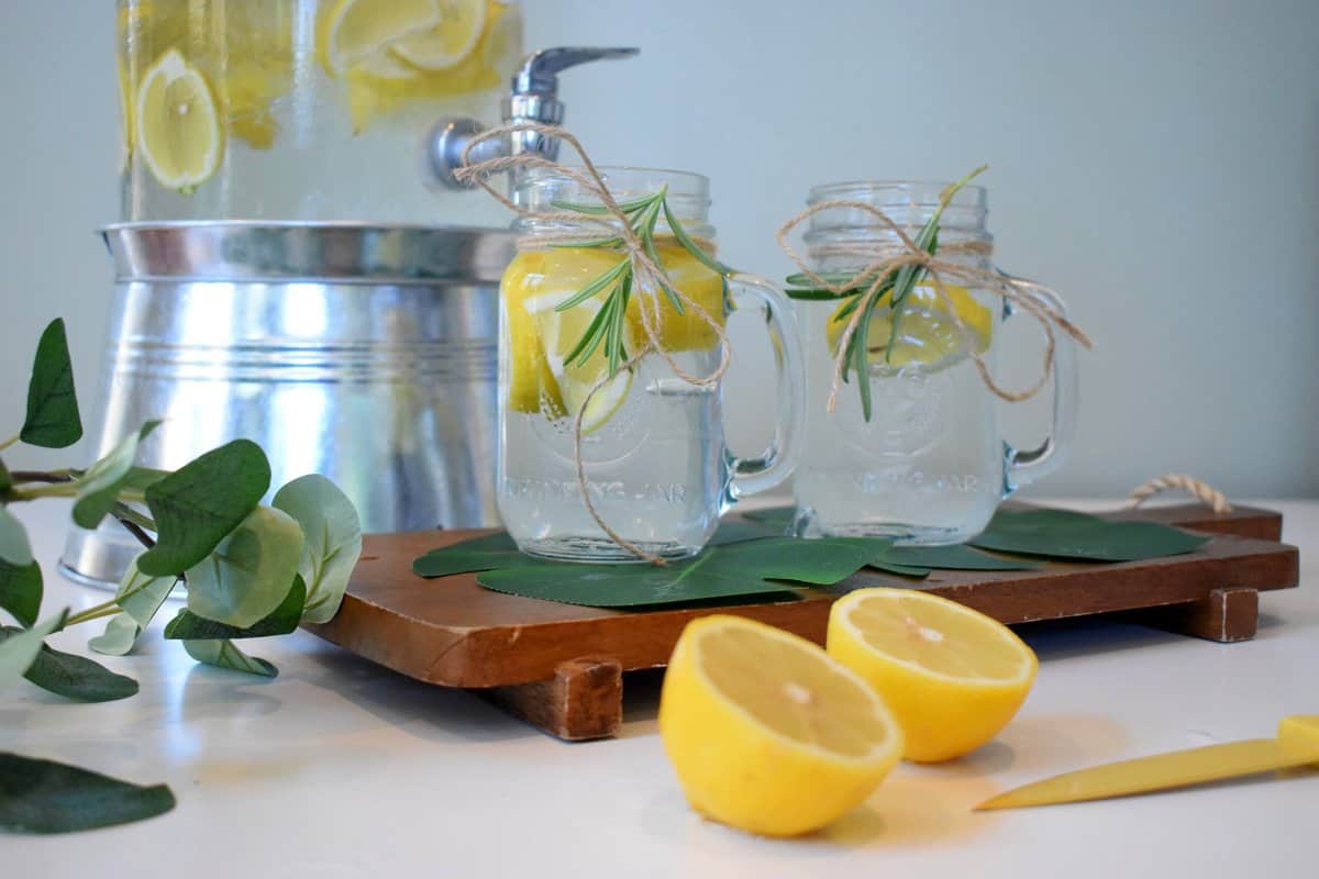 Mason jars with lemon juice that may be consumed in the hormone balanced diet.