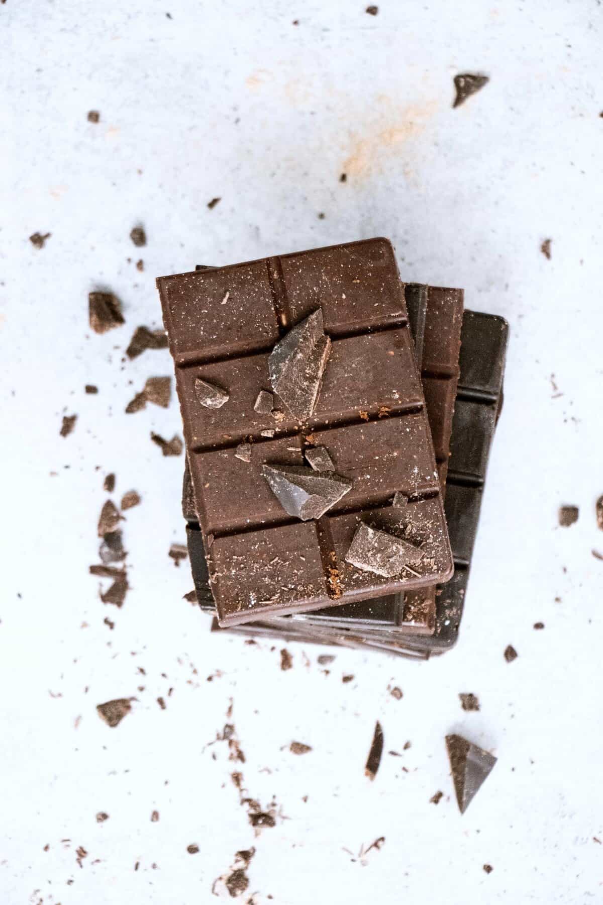 Birds eye view of several dark chocolate squares.