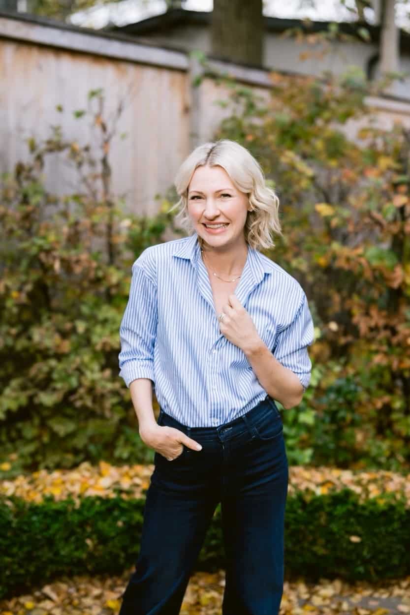 Abbey standing in a garden smiling.