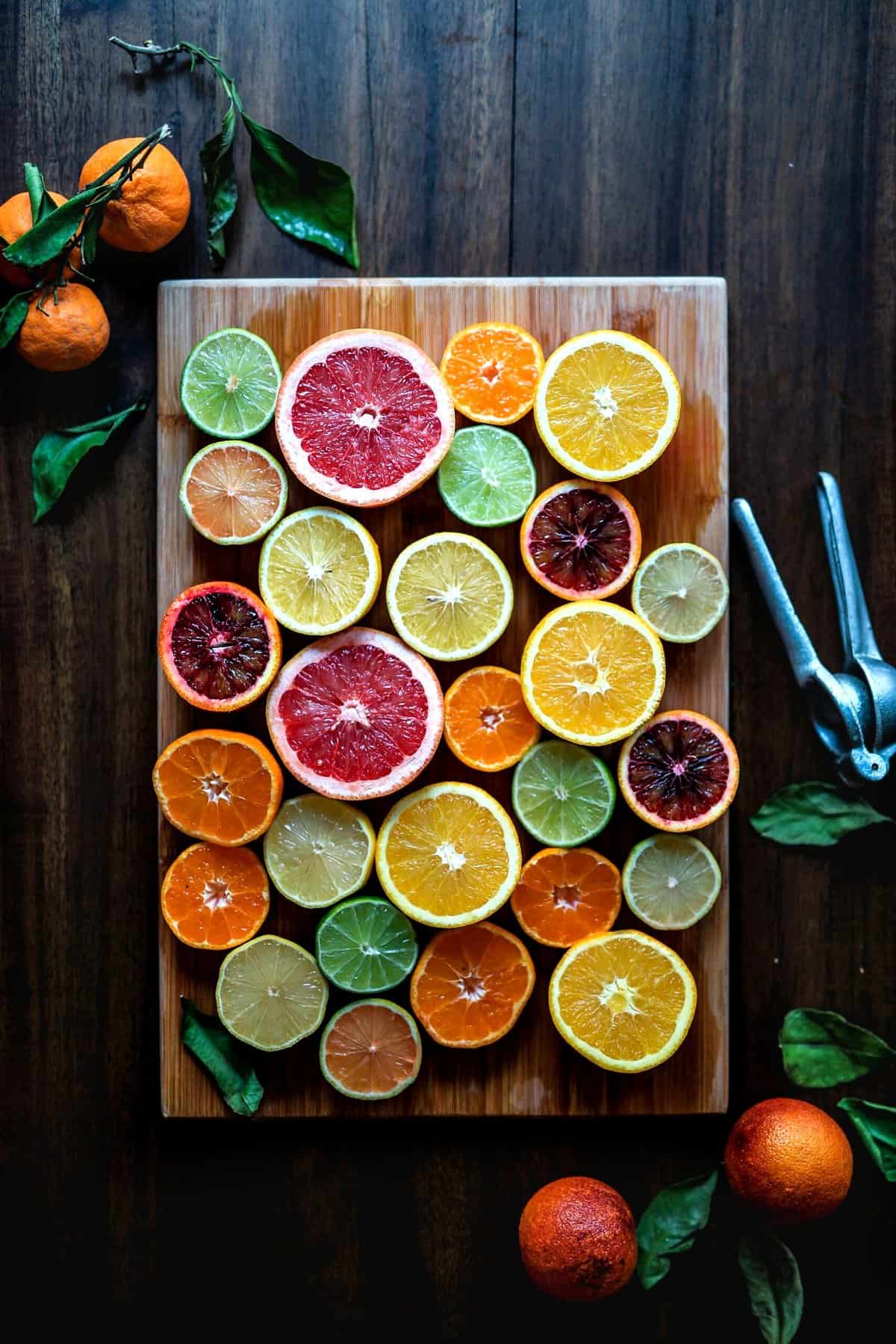 Slices of colorful fruit on a wooden board