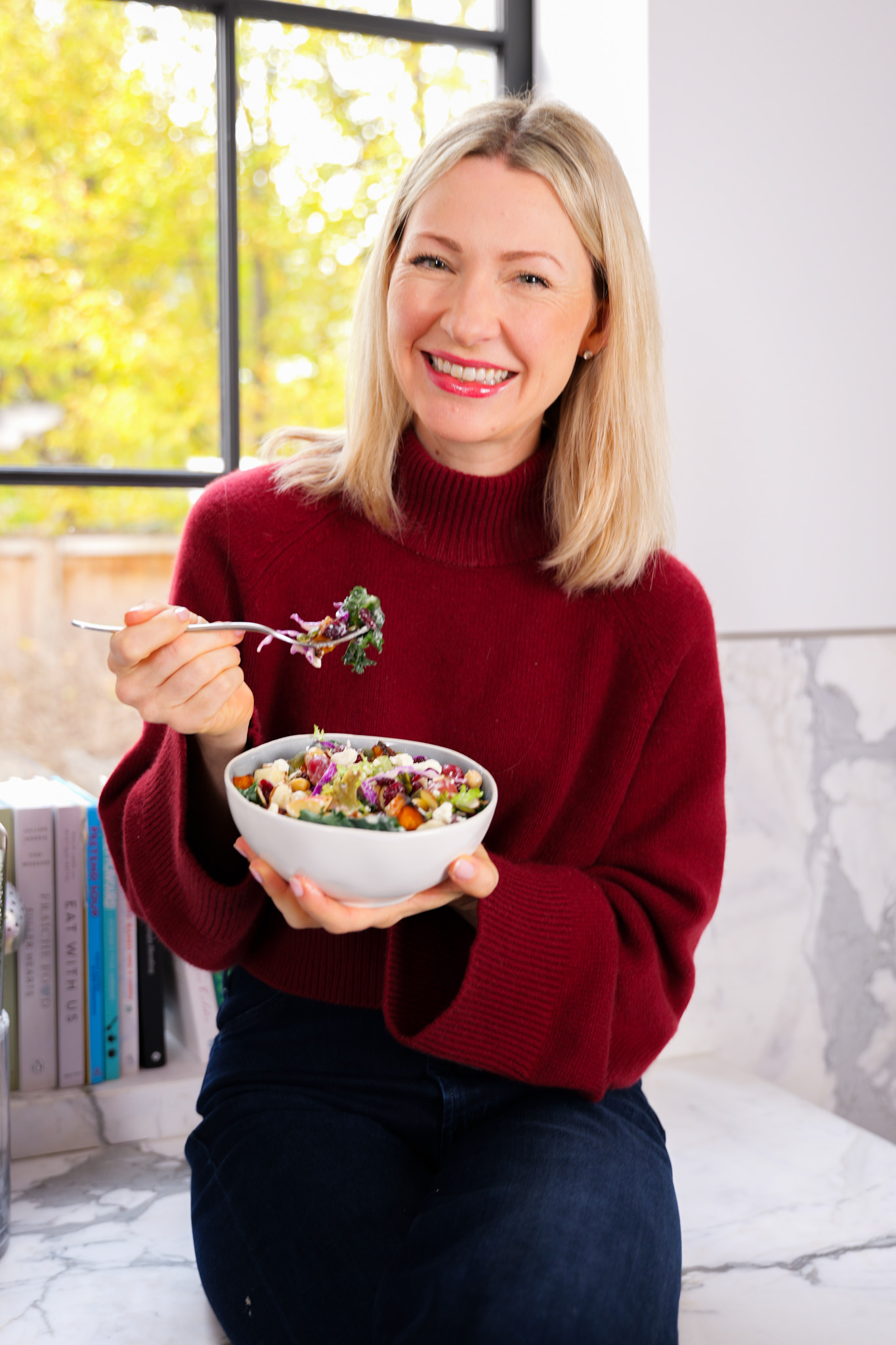 Abbey eating a tahini crunch salad.