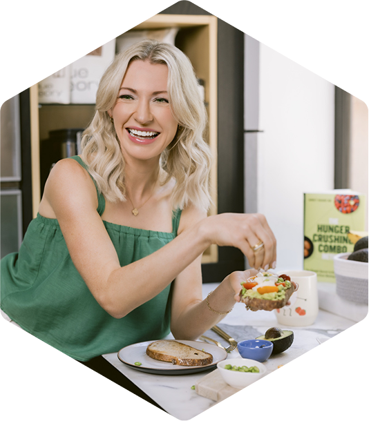 Abbey smiling at table