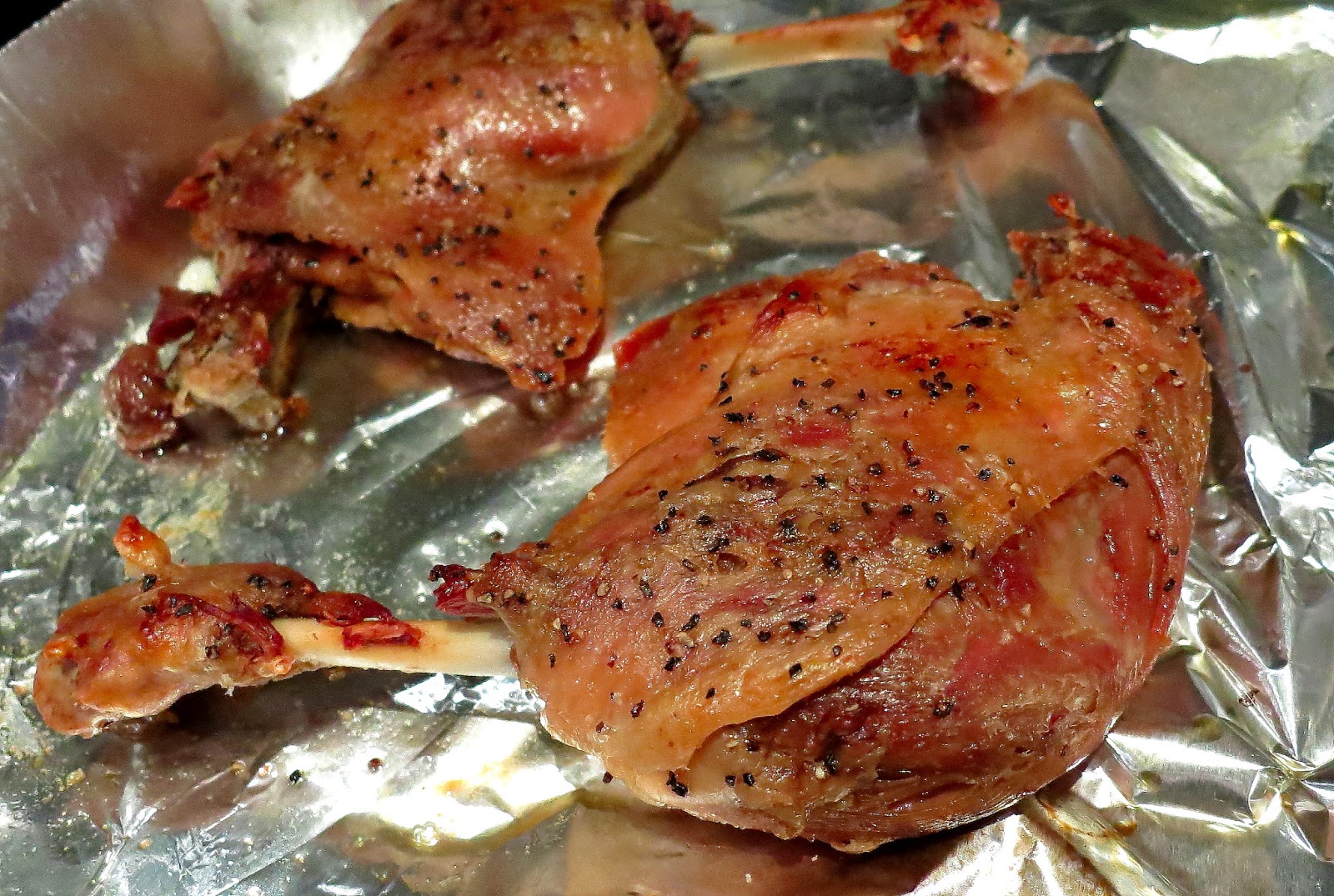 A pan with duck being seared.