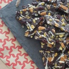 A serving of chocolate bark with cranberries and pistachios.
