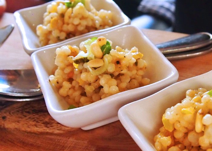 Close up of couscous in small servings.