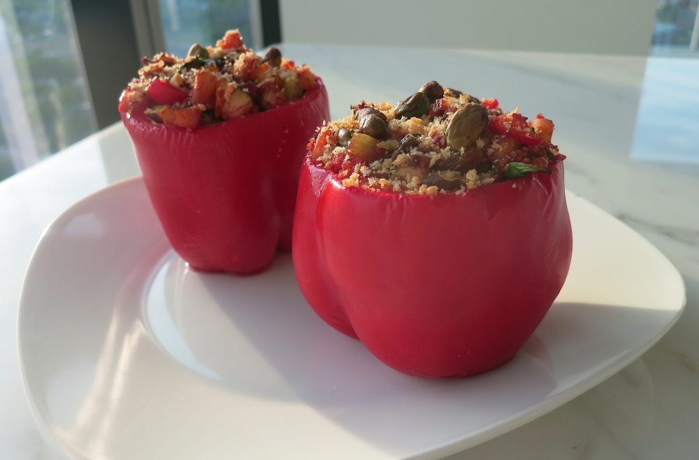 Two Moroccan beef and couscous stuffed bell peppers.