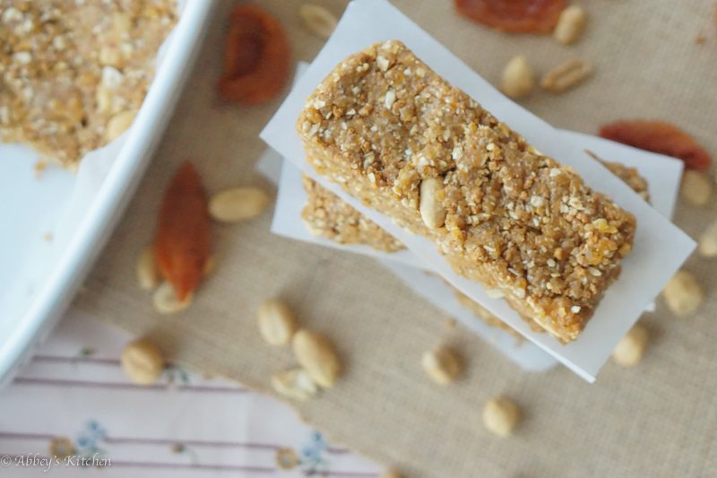 An overhead photo of a stack of gluten free no bake granola bars with peanut butter and apricot.