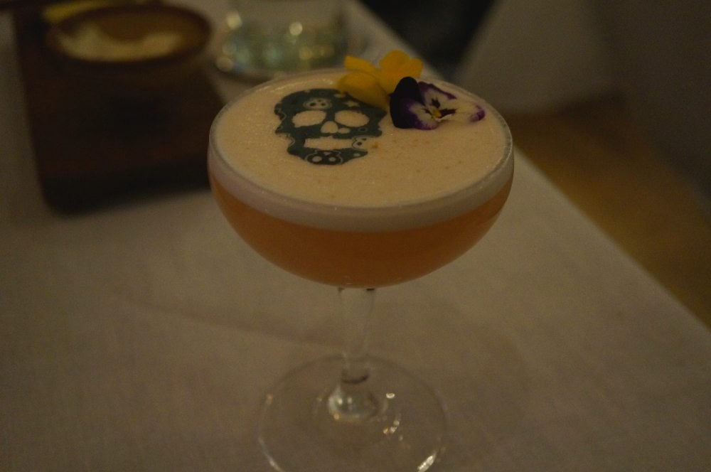 A cocktail with skulls in the foam.