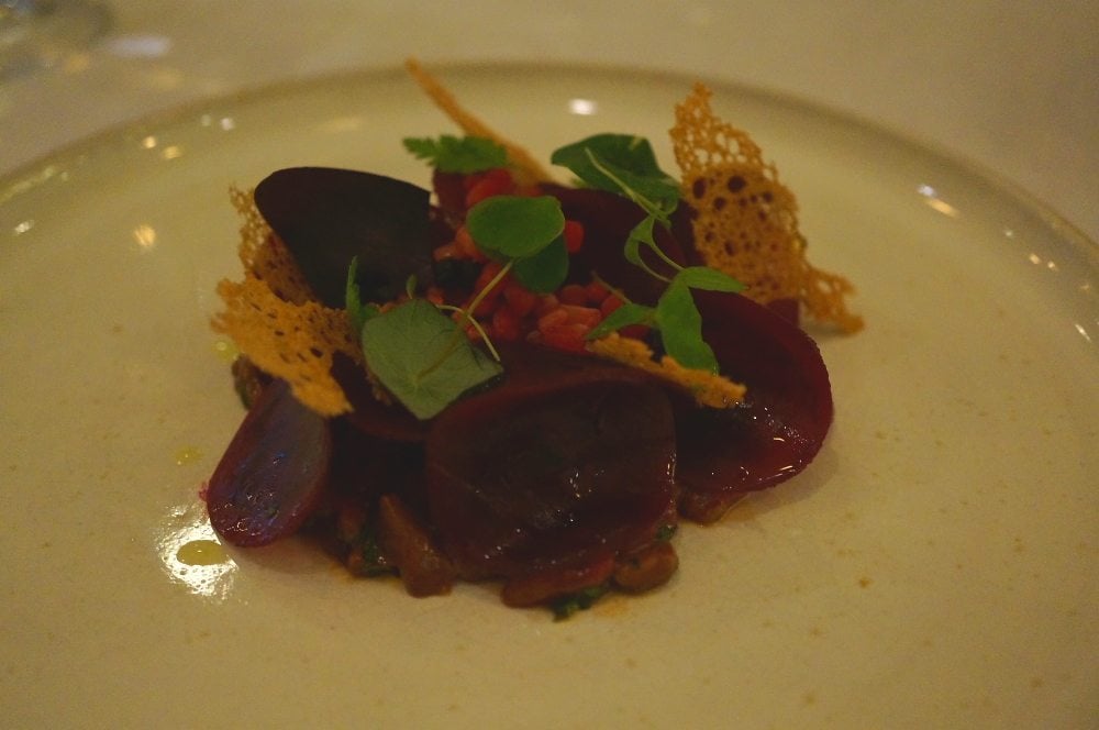 A plate of venison with beets.