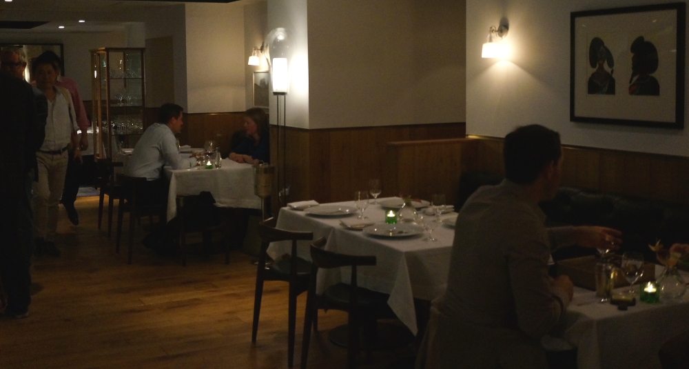 Empty table inside of a dining room.