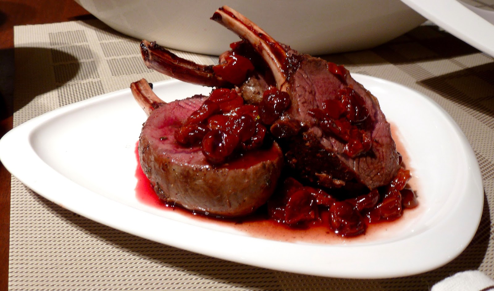 rack of venison on a white dish